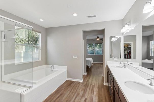 Bathroom, Dual Sink Vanities, Glass Shower, Interior, Recessed Lighting, Wood Texture Flooring