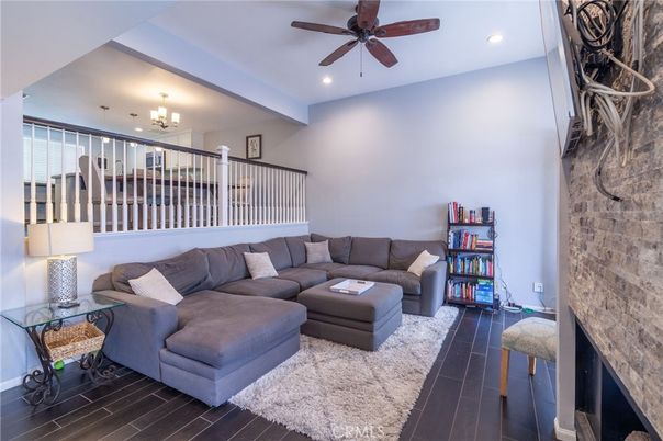 Fireplace, Interior, Living room, Recessed Lighting, Stone Walls, Wood Texture Flooring