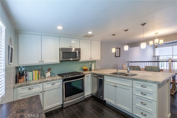 Chandelier, Interior, Kitchen, Pendant Lights, Recessed Lighting, Stainless Steel Appliances, Wood Texture Flooring