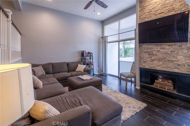 Fireplace, Interior, Living room, Recessed Lighting, Stone Walls, Wood Texture Flooring