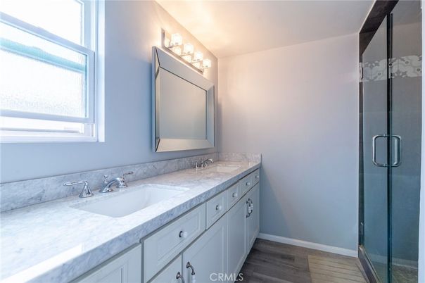 Bathroom, Dual Sink Vanities, Glass Shower, Interior, Wood Texture Flooring
