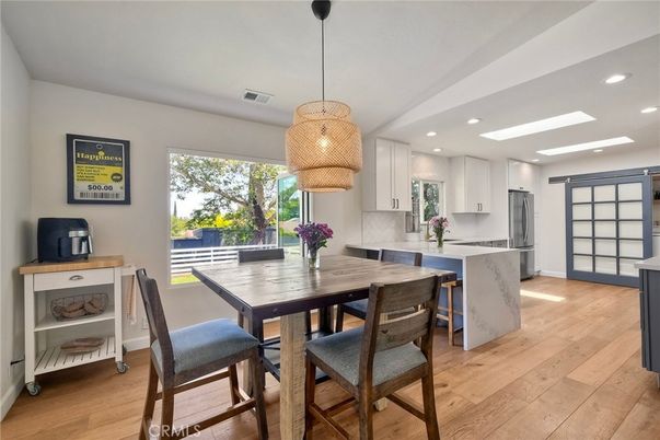 Dining room, Interior, Kitchen, Pendant Lights, Recessed Lighting, Stainless Steel Appliances, Wood Texture Flooring