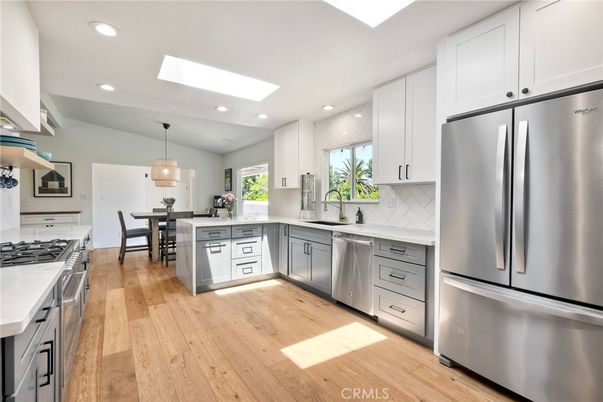 Dining room, Interior, Kitchen, Pendant Lights, Recessed Lighting, Stainless Steel Appliances, Wood Texture Flooring