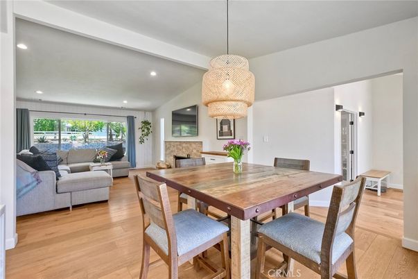 Dining room, Fireplace, Interior, Living room, Pendant Lights, Recessed Lighting, Wood Texture Flooring