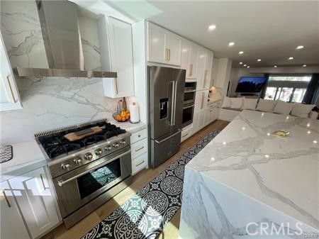 Interior, Kitchen, Marble Walls, Recessed Lighting, Stainless Steel Appliances, Wood Texture Flooring