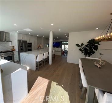 Chandelier, Dining room, Interior, Kitchen, Recessed Lighting, Stainless Steel Appliances, Wood Texture Flooring