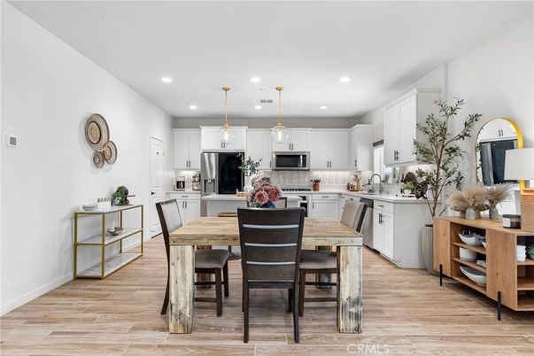 Dining room, Interior, Kitchen, Pendant Lights, Recessed Lighting, Stainless Steel Appliances, Wood Texture Flooring
