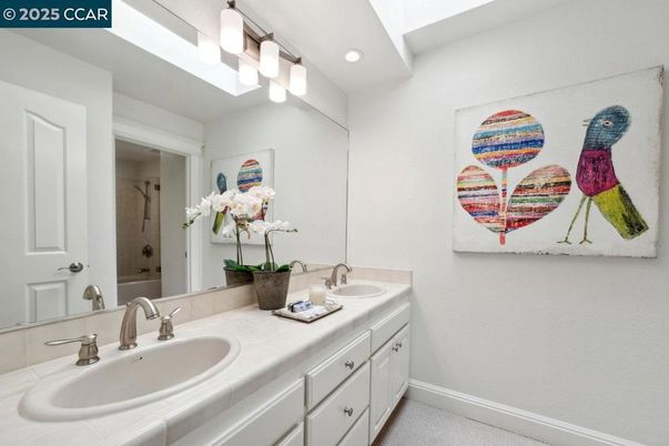 Bathroom, Dual Sink Vanities, Interior, Recessed Lighting, Tile Countertops