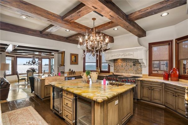 Chandelier, Dining room, Interior, Kitchen, Recessed Lighting, Stainless Steel Appliances, Water, Wooden Beams, Wood Texture Flooring