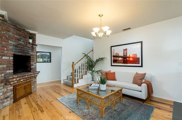 Chandelier, Fireplace, Interior, Living room, Stone Walls, Wood Texture Flooring