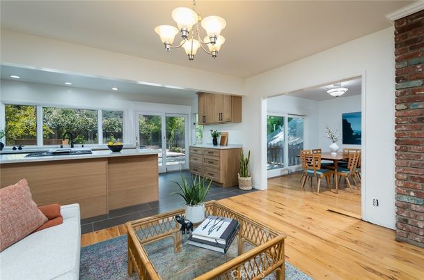 Chandelier, Dining room, Interior, Kitchen, Living room, Recessed Lighting, Stone Walls, Wood Texture Flooring