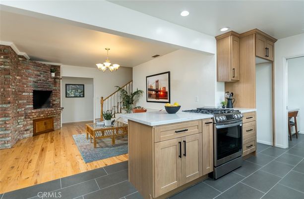 Chandelier, Fireplace, Interior, Kitchen, Recessed Lighting, Stone Walls, Wood Texture Flooring