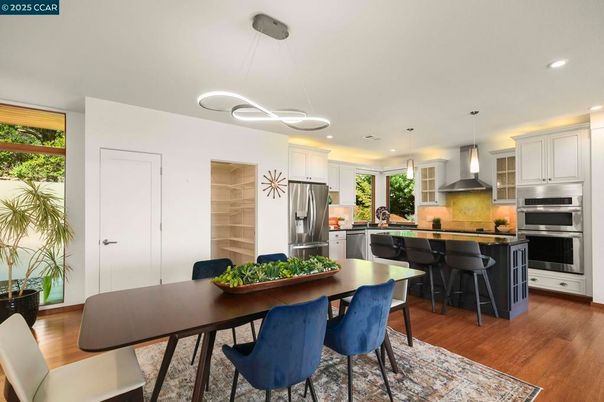 Dining room, Interior, Kitchen, Pendant Lights, Recessed Lighting, Stainless Steel Appliances, Wood Texture Flooring