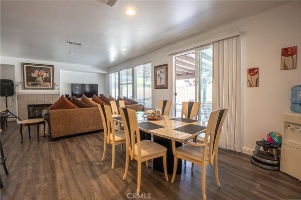Dining room, Fireplace, Interior, Living room, Recessed Lighting, Wood Texture Flooring