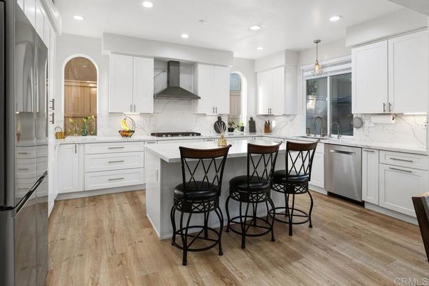 Interior, Kitchen, Marble Walls, Pendant Lights, Recessed Lighting, Stainless Steel Appliances, Wood Texture Flooring