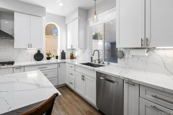 Interior, Kitchen, Marble Walls, Pendant Lights, Recessed Lighting, Stainless Steel Appliances, Wood Texture Flooring
