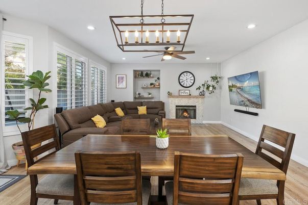 Dining room, Fireplace, Interior, Living room, Pendant Lights, Recessed Lighting, Wood Texture Flooring