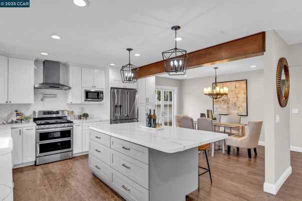 Chandelier, Dining room, Interior, Kitchen, Pendant Lights, Recessed Lighting, Stainless Steel Appliances, Wooden Beams, Wood Texture Flooring