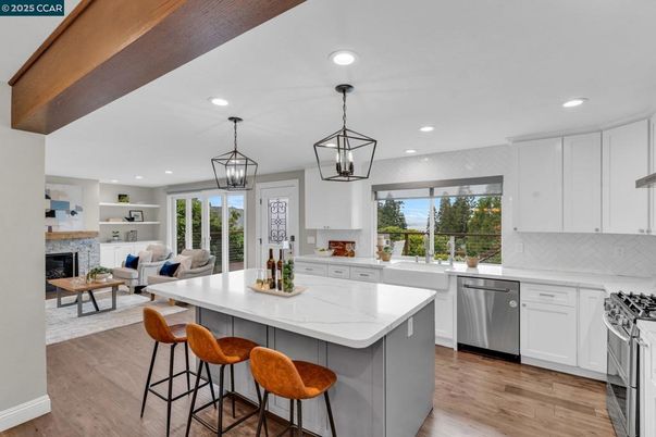 Fireplace, Interior, Kitchen, Living room, Pendant Lights, Recessed Lighting, Stainless Steel Appliances, Wood Texture Flooring