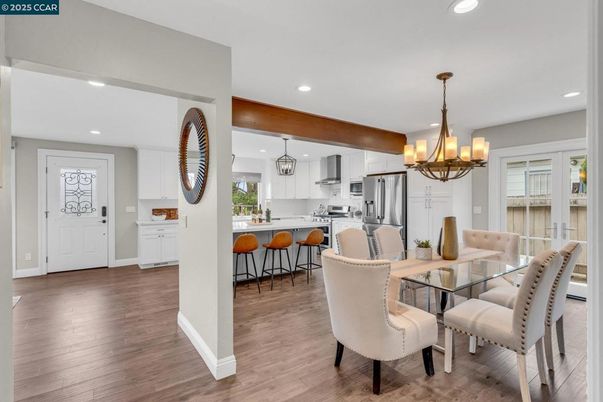 Chandelier, Dining room, Interior, Kitchen, Pendant Lights, Recessed Lighting, Stainless Steel Appliances, Wooden Beams, Wood Texture Flooring