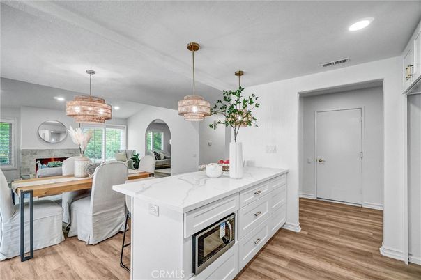 Chandelier, Dining room, Fireplace, Interior, Pendant Lights, Recessed Lighting, Wood Texture Flooring