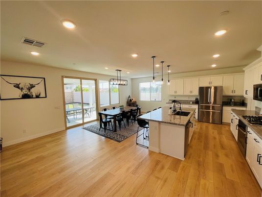 Dining room, Interior, Kitchen, Pendant Lights, Recessed Lighting, Stainless Steel Appliances, Wood Texture Flooring