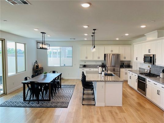 Dining room, Interior, Kitchen, Pendant Lights, Recessed Lighting, Stainless Steel Appliances, Wood Texture Flooring