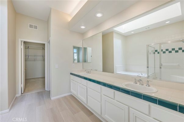 Bathroom, Dual Sink Vanities, Glass Shower, Interior, Recessed Lighting, Tile Countertops, Wood Texture Flooring