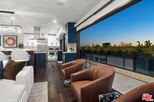 Chandelier, Dining room, Interior, Kitchen, Living room, Pendant Lights, Recessed Lighting, Stainless Steel Appliances, Wood Texture Flooring