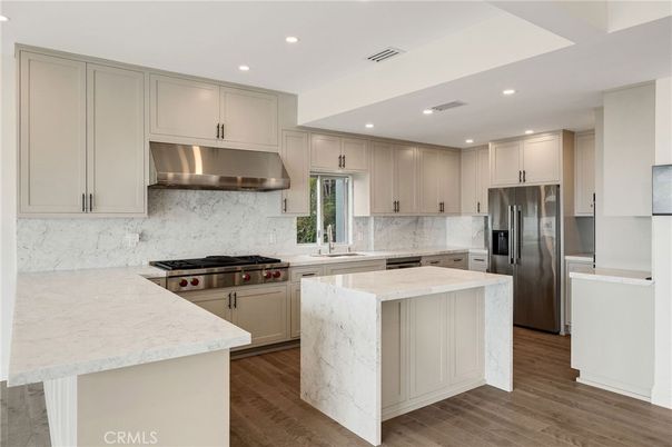 Interior, Kitchen, Marble Walls, Recessed Lighting, Stainless Steel Appliances, Wood Texture Flooring