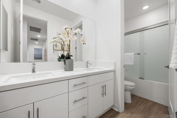 Bathroom, Dual Sink Vanities, Interior, Recessed Lighting, Wood Texture Flooring