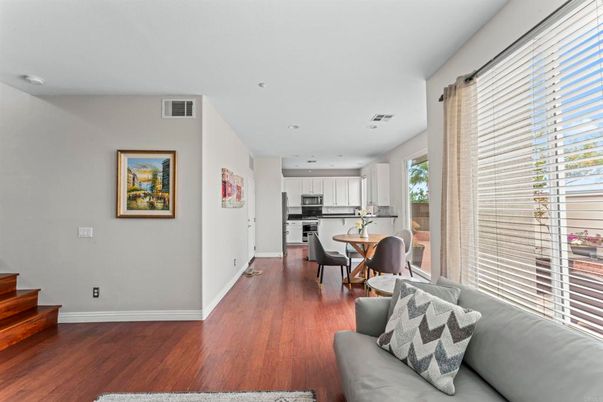 Dining room, Interior, Kitchen, Living room, Recessed Lighting, Stainless Steel Appliances, Wood Texture Flooring