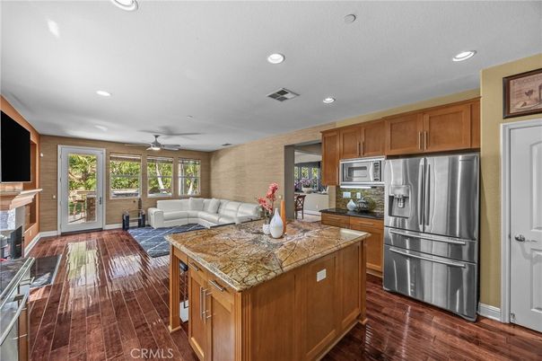 Fireplace, Interior, Kitchen, Living room, Recessed Lighting, Stainless Steel Appliances, Wood Texture Flooring