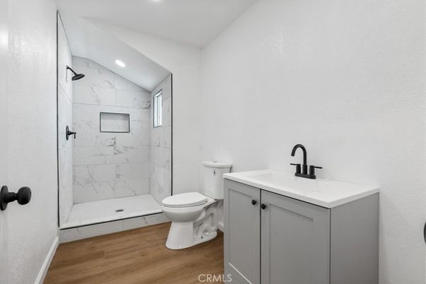 Bathroom, Glass Shower, Interior, Marble Walls, Recessed Lighting, Wood Texture Flooring
