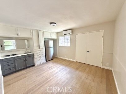 Empty room, Interior, Kitchen, Stainless Steel Appliances, Wood Texture Flooring