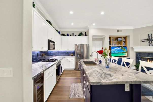 Fireplace, Interior, Kitchen, Recessed Lighting, Stainless Steel Appliances, Wood Texture Flooring