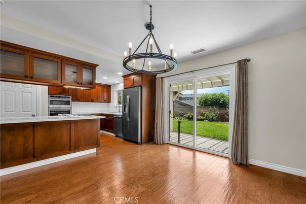 Chandelier, Interior, Kitchen, Pendant Lights, Recessed Lighting, Stainless Steel Appliances, Wood Texture Flooring