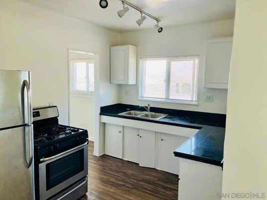Interior, Kitchen, Tile Countertops, Wood Texture Flooring