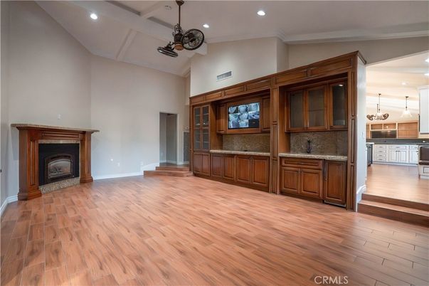 Empty room, Fireplace, Interior, Kitchen, Pendant Lights, Recessed Lighting, Wood Texture Flooring