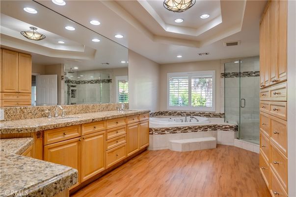 Bathroom, Dual Sink Vanities, Glass Shower, Interior, Recessed Lighting, Wood Texture Flooring