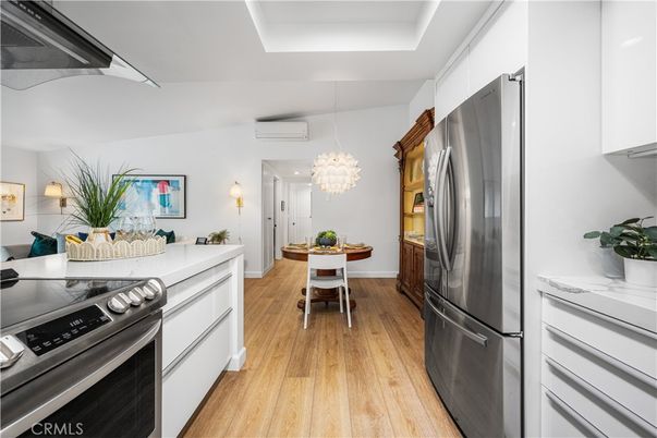 Chandelier, Dining room, Interior, Kitchen, Pendant Lights, Stainless Steel Appliances, Wood Texture Flooring