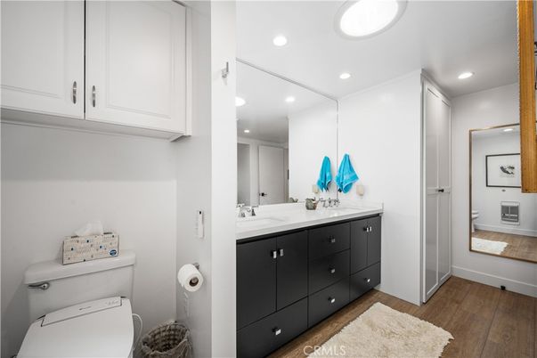 Bathroom, Interior, Recessed Lighting, Washer, Wood Texture Flooring