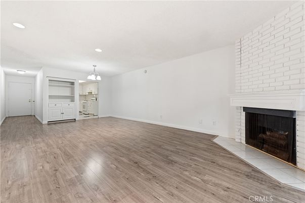Chandelier, Empty room, Fireplace, Interior, Recessed Lighting, Wood Texture Flooring
