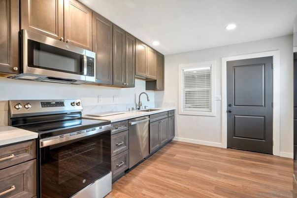 Interior, Kitchen, Recessed Lighting, Stainless Steel Appliances, Wood Texture Flooring