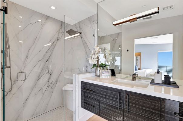 Bathroom, Dual Sink Vanities, Glass Shower, Interior, Marble Walls, Recessed Lighting