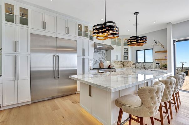 Interior, Kitchen, Marble Walls, Pendant Lights, Recessed Lighting, Stainless Steel Appliances, Wood Texture Flooring
