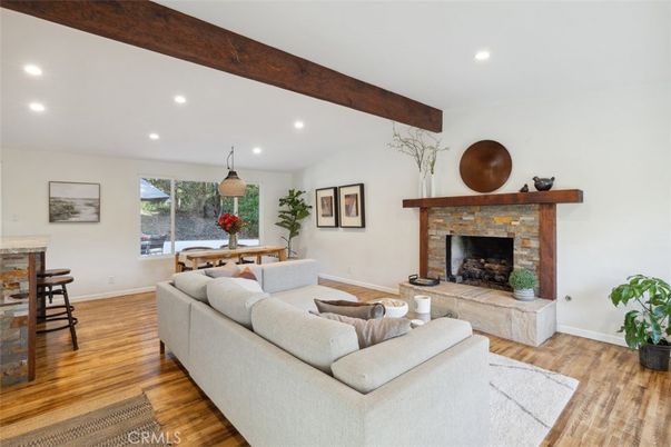 Dining room, Fireplace, Interior, Living room, Pendant Lights, Recessed Lighting, Wooden Beams, Wood Texture Flooring