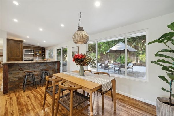 Dining room, Interior, Kitchen, Pendant Lights, Recessed Lighting, Stainless Steel Appliances, Wood Texture Flooring