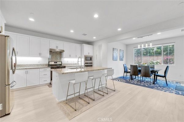 Dining room, Interior, Kitchen, Pendant Lights, Recessed Lighting, Stainless Steel Appliances, Wood Texture Flooring