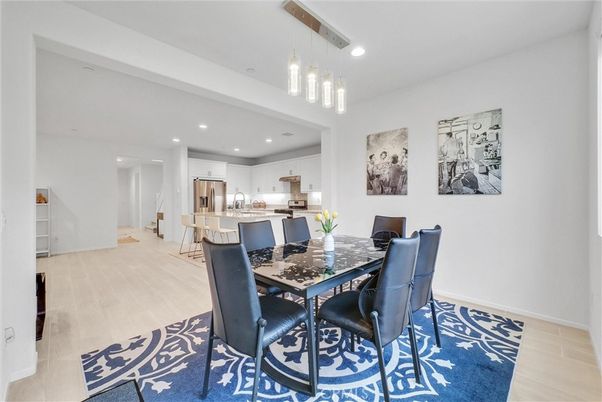 Dining room, Interior, Kitchen, Pendant Lights, Recessed Lighting, Stainless Steel Appliances, Wood Texture Flooring
